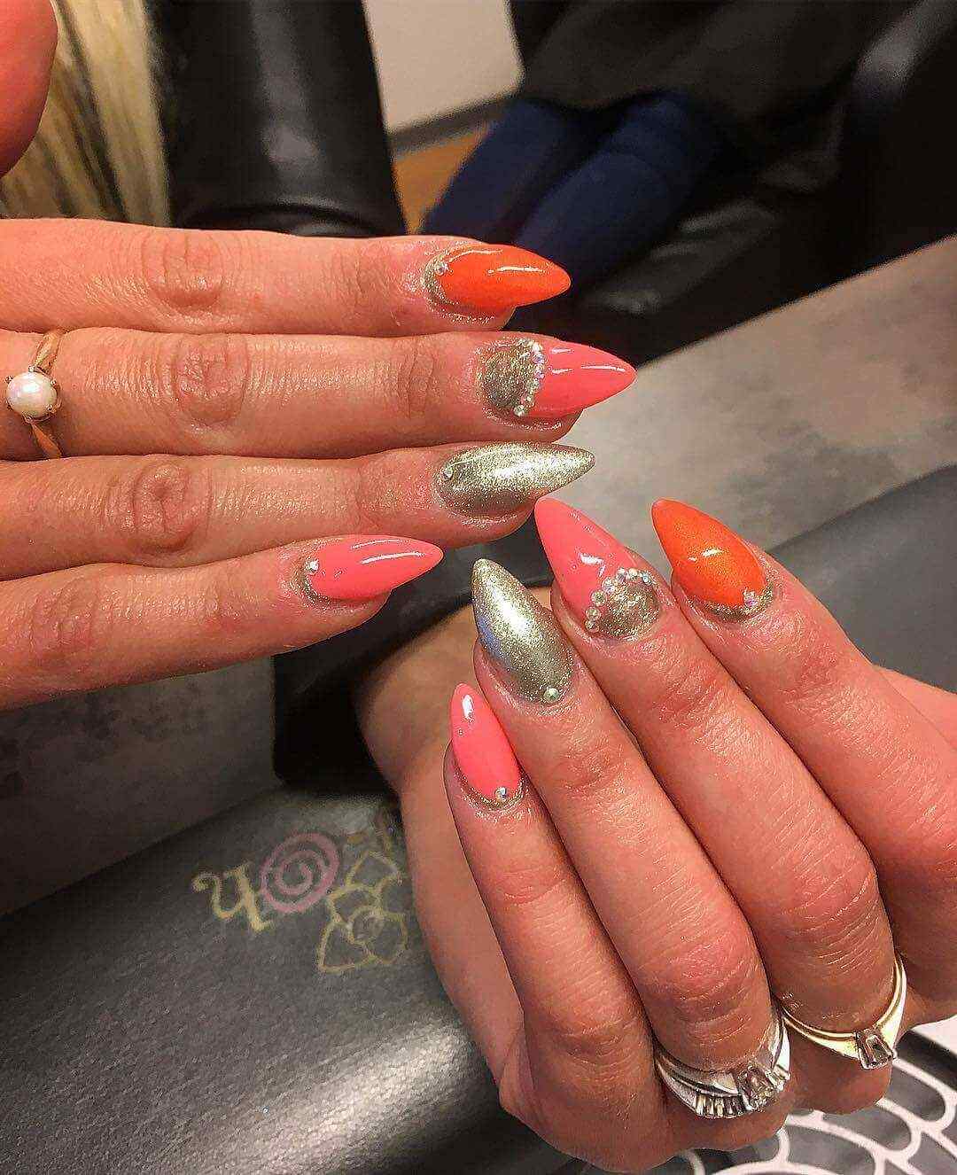 elegant orange with golden nails