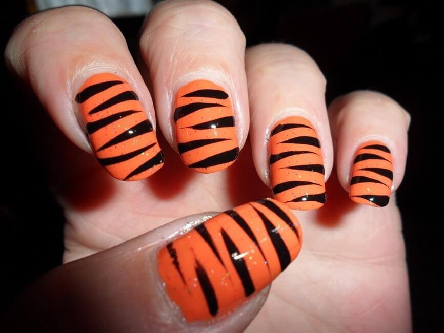 orange nails with black lines
